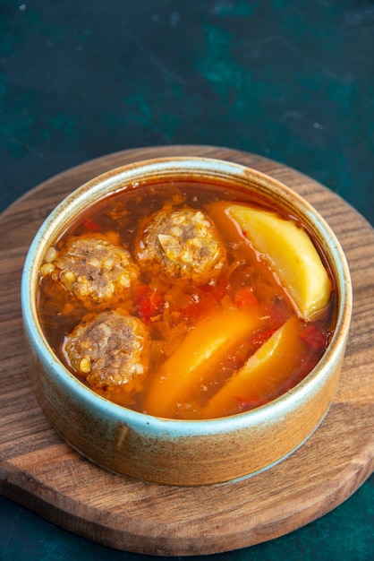 Front view meat balls soup with potatoes inside round plate on the dark-blue wall food soup meat dish dinner vegetable