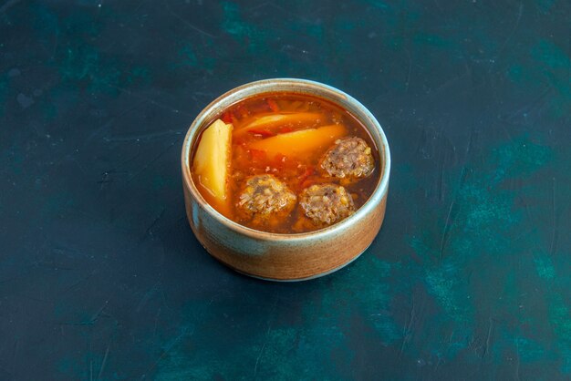 Front view meat balls soup with potatoes inside round plate on dark-blue wall food soup meat dish dinner vegetables
