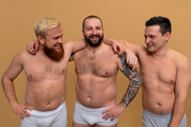 Front view men posing together in studio