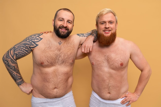 Front view men posing together in studio