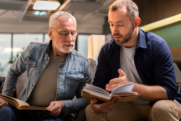 Front view men reading together