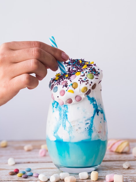 Front view of milkshake on wooden table