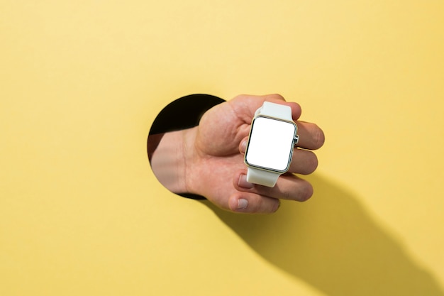 Free photo front view mockup smartwatch held by person