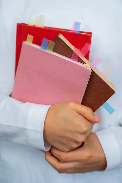 Free photo front view model holding books