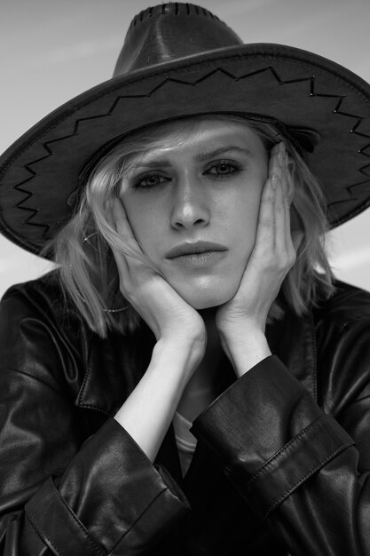 Front view model posing with hat black and white