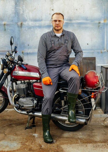 Front view of motorcycle mechanic with protective glasses