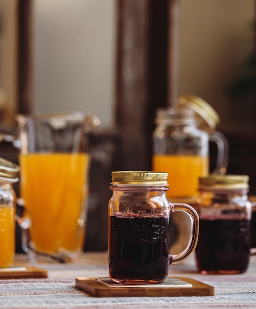 Front view mug of soft drink on a stand