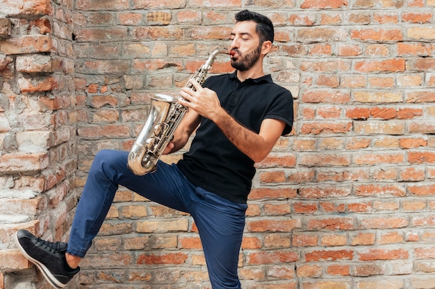 Front view of musician playing saxophone concept