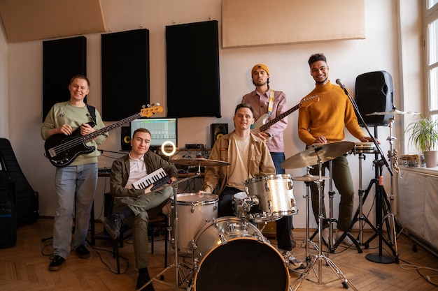 Free photo front view musicians working in studio