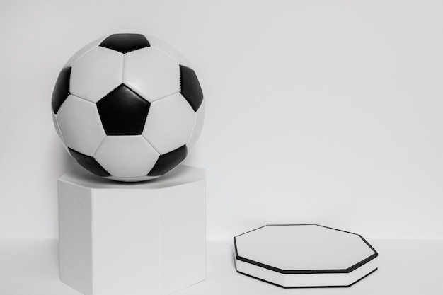 Front view of new football on pedestal with copy space