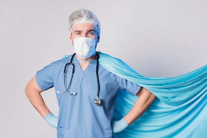 Front view nurse wearing medical mask and cape