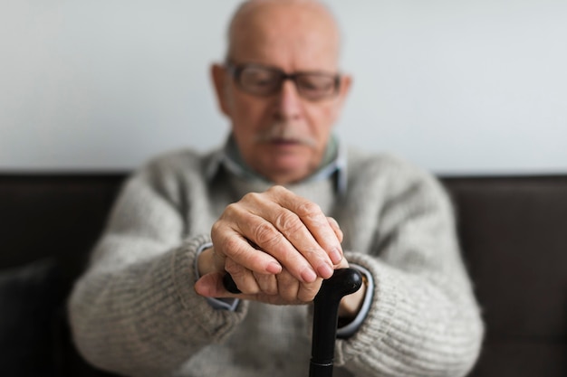 Free photo front view of old man in a nursing home