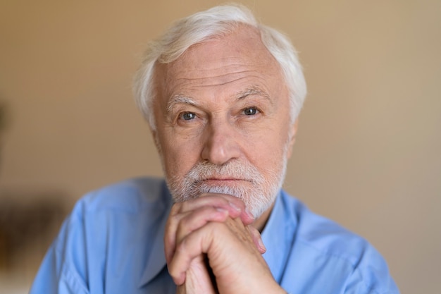 Free photo front view old man posing indoors