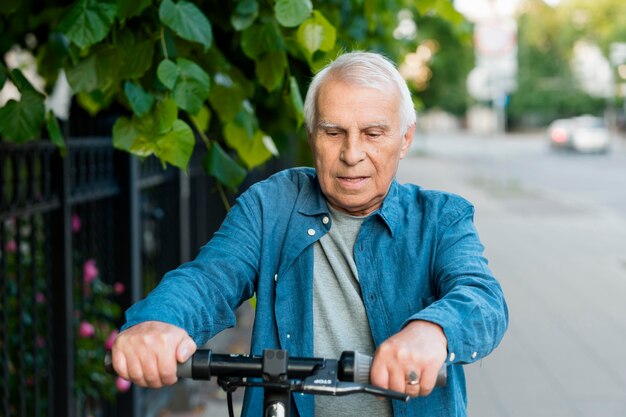 Front view of old man on scooter