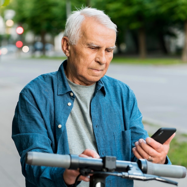 Front view of old man on scooter