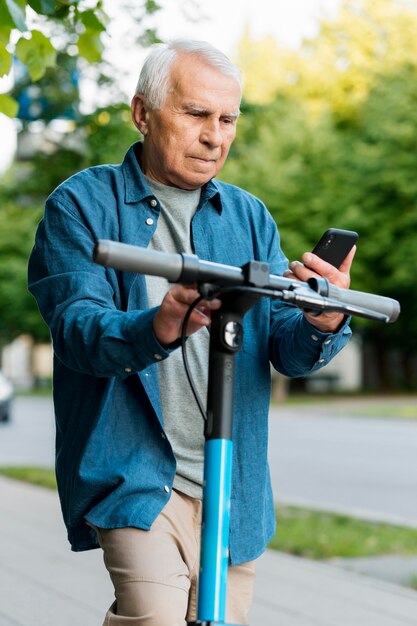 Front view of old man on scooter