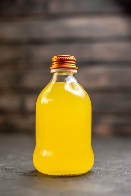 Front view orange juice bottle on isolated surface