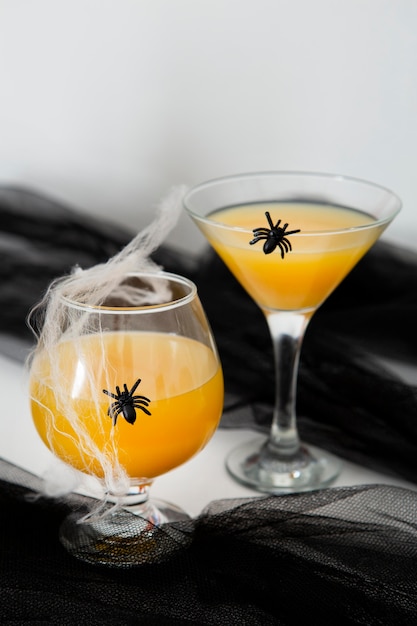 Free photo front view of orange juice halloween concept