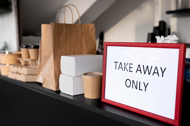 Front view of packed food with takeaway only sign