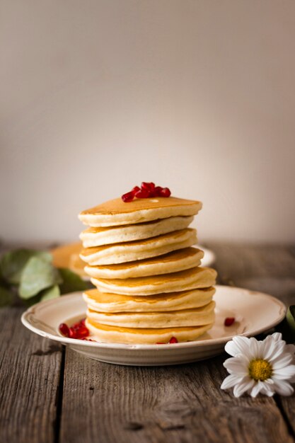 Front view pancake tower with pomegranate seeds