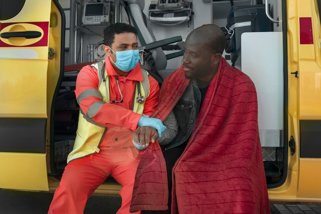 Front view paramedic checking patient