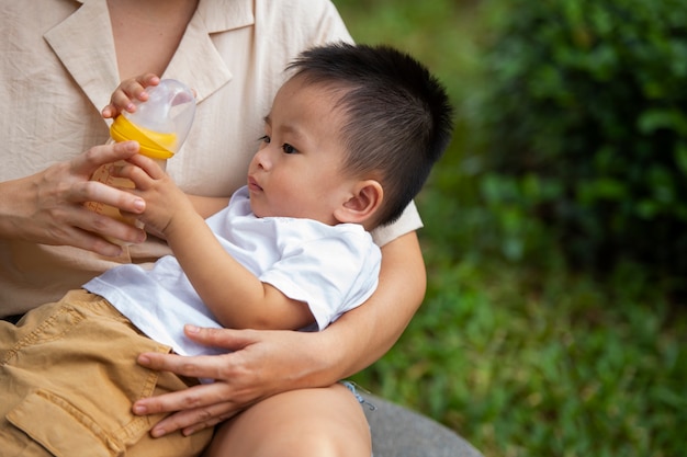 Front view parent holding baby