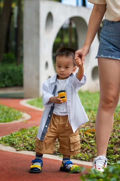 Front view parent holding kid