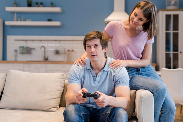 Front view parents playing video games at home