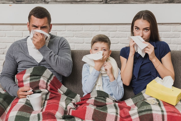 Front view parents with son being sick