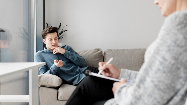 Free Photo front view of patient and psychologist