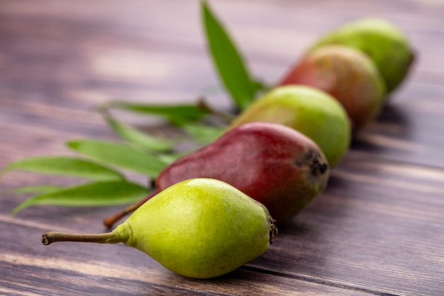 Front view of peaches on wooden surface