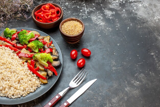 Front view pearl barley with tasty cooked vegetable