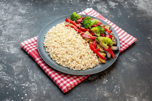 Front view pearl barley with tasty cooked vegetable