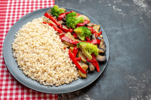 Front view pearl barley with tasty cooked vegetable