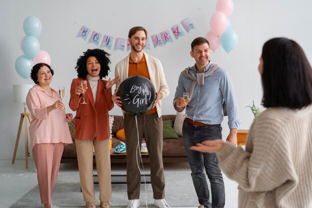 Free photo front view people celebrating at gender reveal party