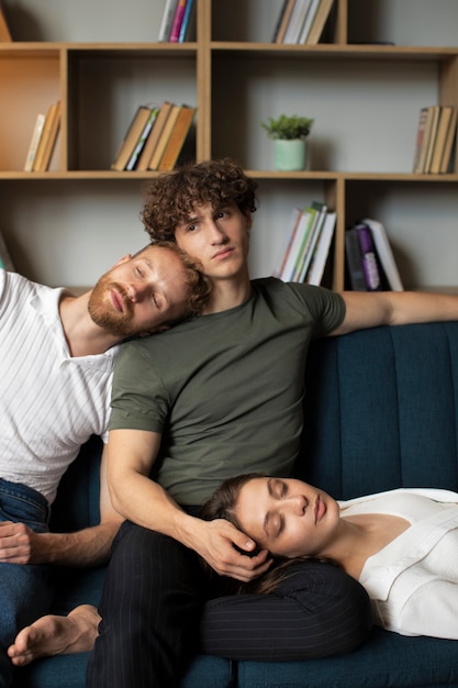 Front view people laying on couch