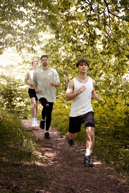 Free photo front view people running together