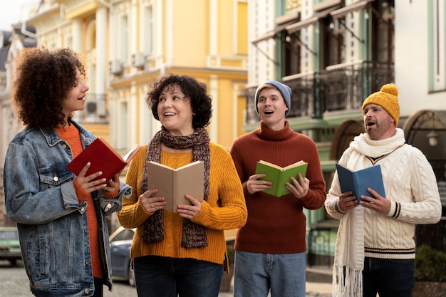 Free photo front view people singing christmas carols