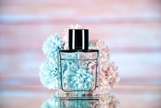 Front view of perfume bottle flowers with a beige