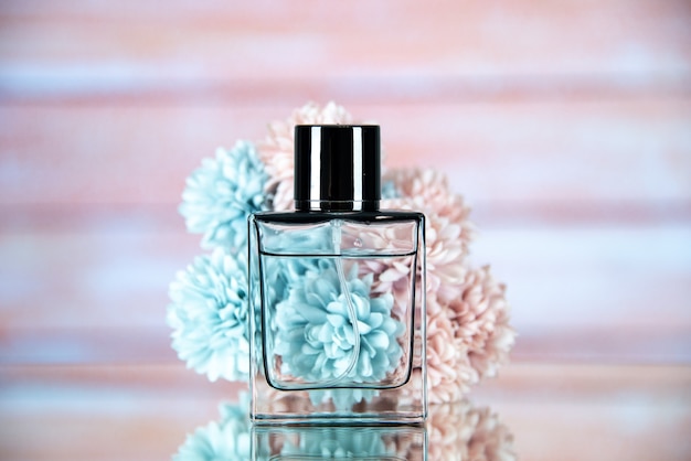 Front view of perfume bottle flowers with a beige