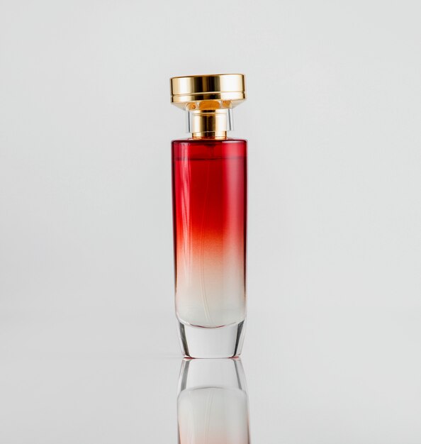 ゴールドプラスチックカバー付きの赤い色の正面香水瓶ガラスモデル