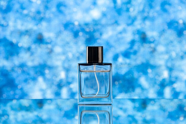 Front view of perfume bottle on light blue