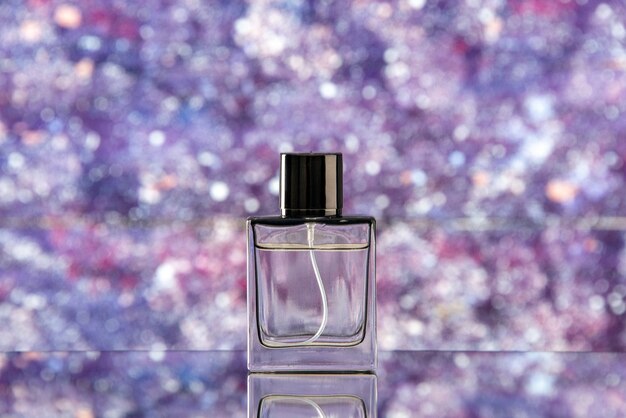 Front view perfume bottle on purple blurred background