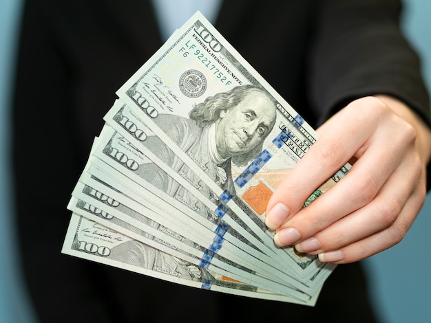 Front view of person holding money