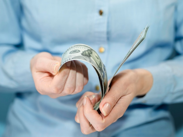 Front view of person holding money