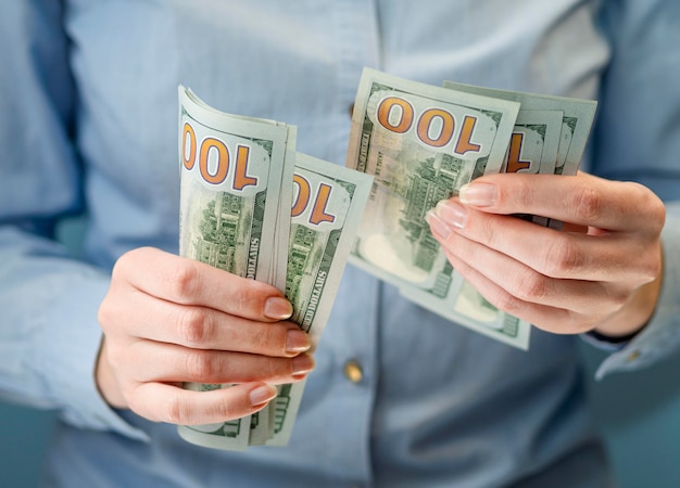 Free Photo front view of person holding money