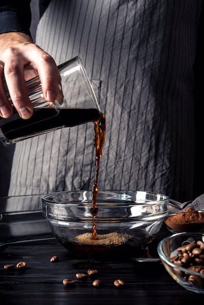 Front view of person pouring coffee in bown