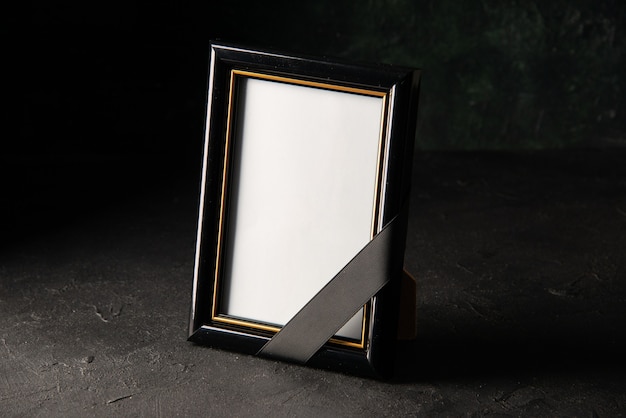 Free photo front view of picture frame on dark