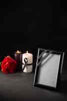 Free photo front view of picture frame with candles on black
