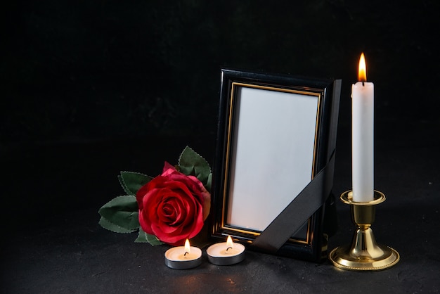 Free photo front view of picture frame with red flower on black